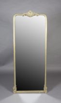 A gilt framed wall mirror, rectangular with rounded corners, with cartouche and foliate cresting and