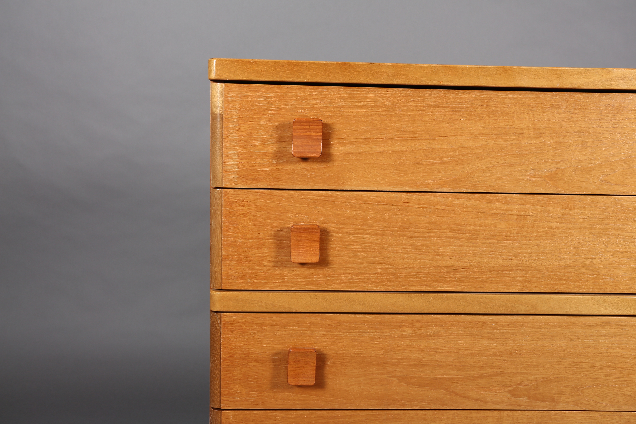 A Stag teak chest c1980s, of five graduated drawers with curved handles on a plinth base, 82cm - Image 2 of 4