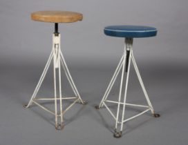 A pair of 1960s white iron revolving stools on triangular frame with PVC upholstered seat