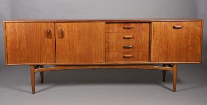 A G Plan 'Brasilia' teak sideboard having a two door cupboard, four drawers and a drop front