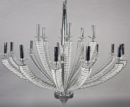 A two tier white metal chandelier of eighteen lights, radiating from a central column, each arm