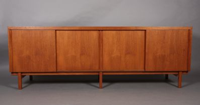 An afromosia sideboard by Fyne Lady of Banbury, having four sliding doors, fitted with five