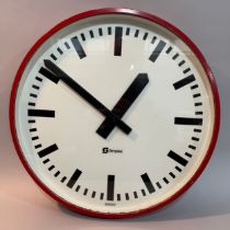 A large red cased Simplex wall clock 55cm diameter