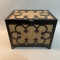 An Arts and Crafts limed oak box, bound with wrought iron tracery, on pierced bracket feet, 38cm