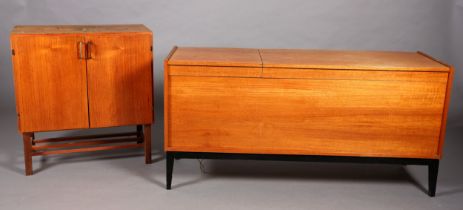 A teak hi-fi cabinet with two lift up tops with divided interior, black apron and on tapered legs (