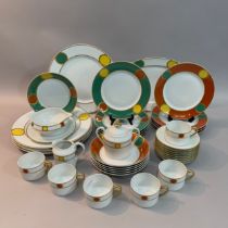 A Limoges Jammet-Seignolles dinner service designed by Jehan Darfeuille, the rims glazed in gilt