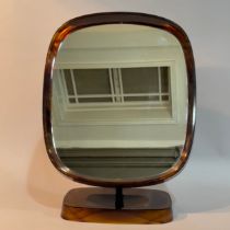 A Danish plastic faux tortoiseshell dressing table mirror on a dished pedestal base 28cm wide x 36.