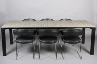 Calligaris, Italy, A grey ceramic and metal extending dining table and six black leather-effect