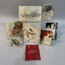 A small collection of Victorian and later greeting cards including a Christmas card in the form of a