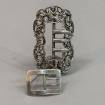 An Edward VII lady's silver belt buckle of oval outline, pierced and chased in foliate scrolls