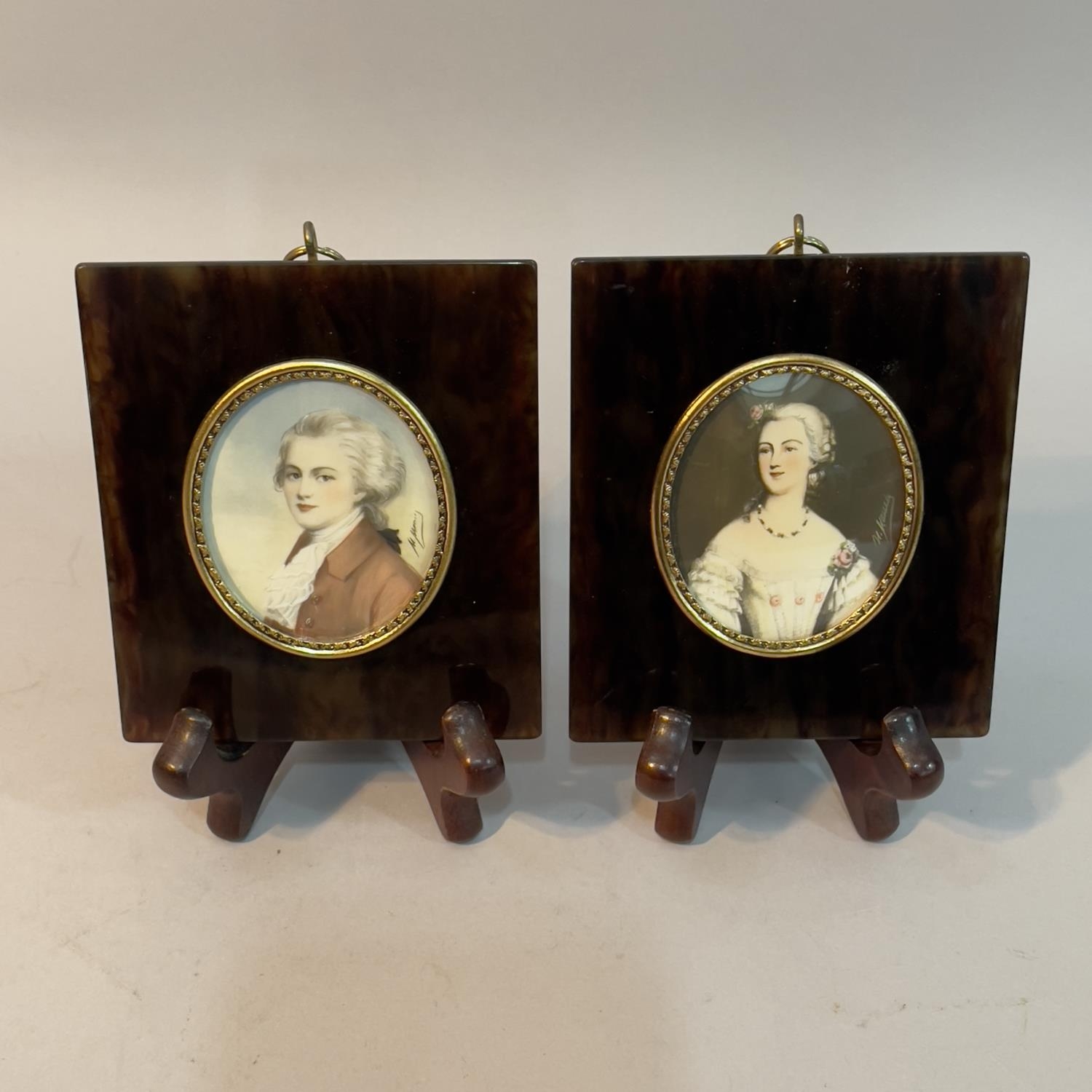 A pair of 20th Century portrait miniatures of Mozart and Mdm. Du Barry oval, indistinctly signed