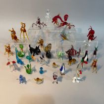 A collection of Murano glass animals including a snail, penguin, Scottie dog, fish, octopus etc. (