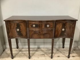 A reproduction mahogany satinwood inlaid sideboard serpentine fronted