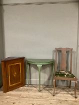 An inlaid hanging corner cupboard, a D shaped green table, a chair with green upholstery