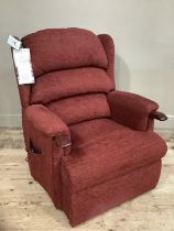 A HSL Craftsman electric recliner chair upholstered in burgundy fabric