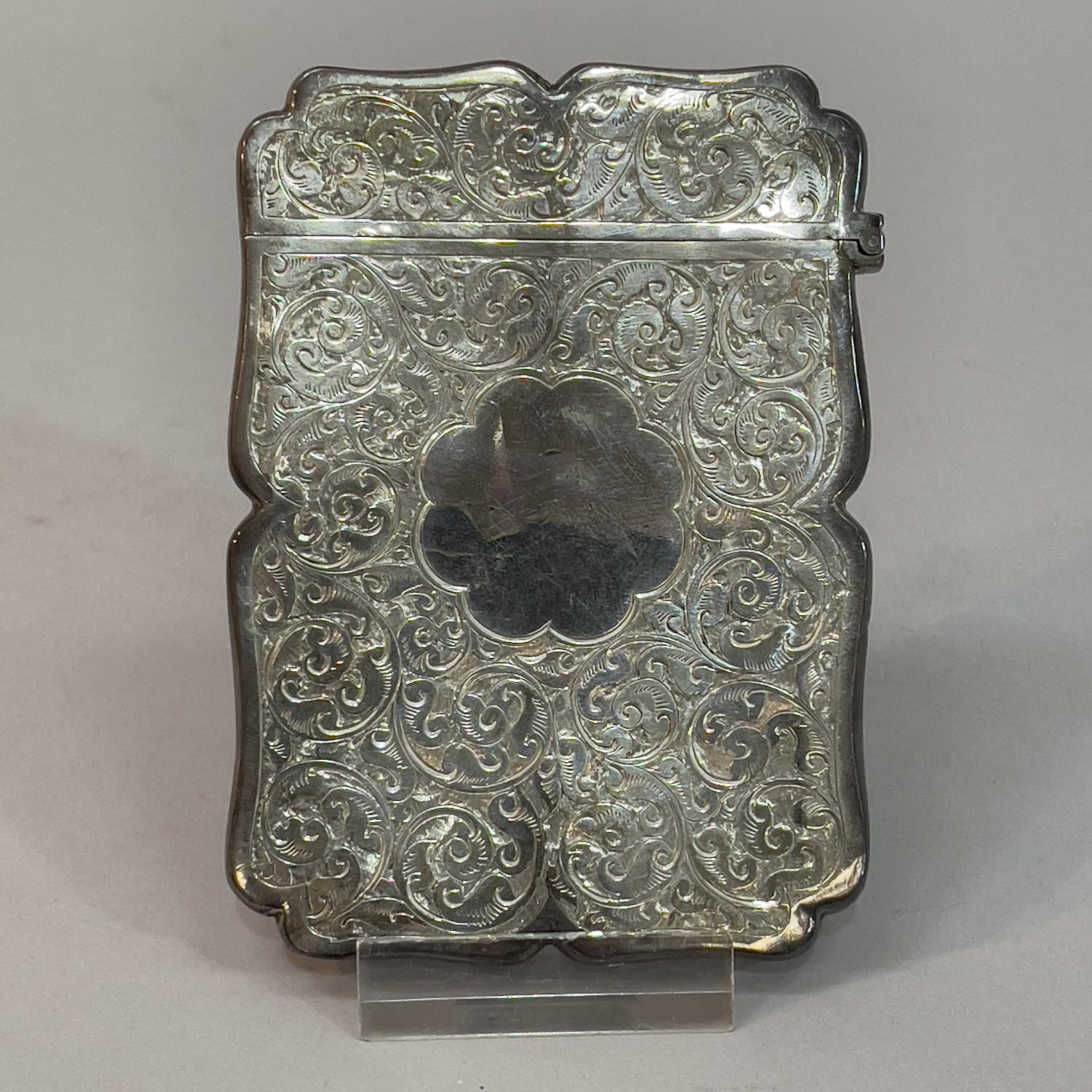 A Victorian silver card case, Birmingham 1894, Colen Hewer, Cheshire, foliate scroll engraved with