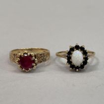 Two dress rings both in 9ct. gold, variously claw set with synthetic ruby, sapphire and opal,