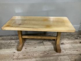 A bleached oak coffee table with stretcher on twin supports, 90cm wide