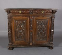 A 19TH CENTURY CONTINENTAL OAK CUPBOARD, having a moulded and writhen lobe carved cornice fitted