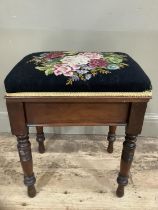 A mahogany piano stool converted to a sewing box on turned legs with contents