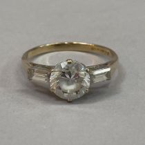 A Cubic Zirconia three stone ring in 9ct. gold approx weight 2g