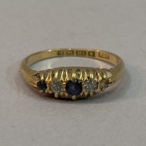 A George V sapphire and diamond five stone ring in 18ct gold (at fault - one sapphire missing),