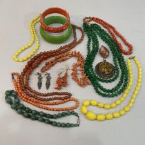 A collection of early to mid 20th century costume jewellery including composite bangles, necklaces