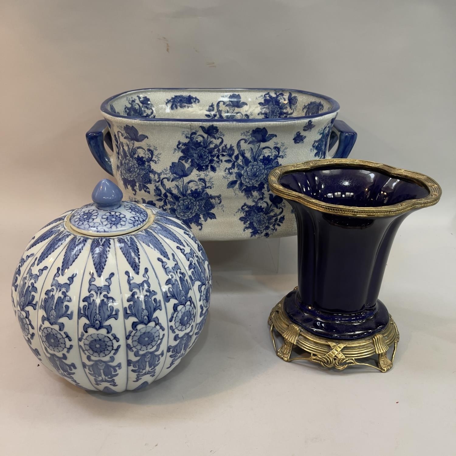A reproduction blue and white two handled foot bath
