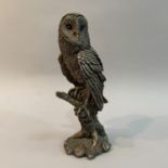 A filled white metal (tests as silver) model of a Barn Owl by Country Artists, modelled on a branch,