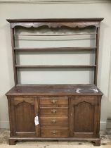 An oak dresser with delft rack