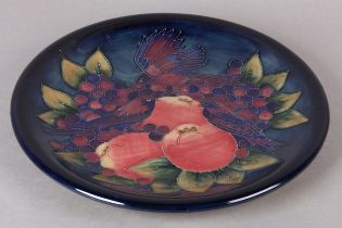 A Moorcroft pottery 'Finches and Berries' charger, painted and tube lined, impressed mark and