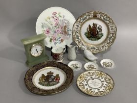 Two Spode Elizabeth II commemorative plates, a Buckingham Palace souvenir mug, a Port Meirion parian