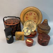 A Japanese lacquered three layered food stacking container in orange and black, a red an gilt