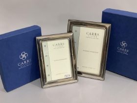 A pair of modern sterling silver photograph frames of graduated size, boxed, as new, 18.5cm x 13.5cm