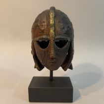 A bronze replica of the Sutton Hoo helmet by Peter Lyell of the Bradshaw foundation, from a