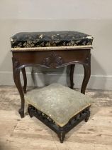 A mahogany piano stool with carved apron on cabriole legs together witha mahogany foot stool