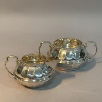 A George V silver sugar bowl and cream jug pair by Ogdens of Harrogate and London, indented of