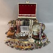 A collection of costume jewellery including necklaces, baby's wristwatches, brooches, earrings and