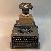An Empire portable typewriter and a WWII children's gas mask with address in Liverpool to Wales