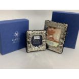 A pair of modern sterling silver photograph frames of graduated size, embossed with teddy bear and