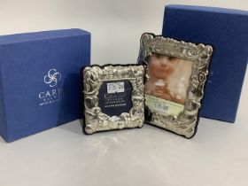 A pair of modern sterling silver photograph frames of graduated size, embossed with teddy bear and
