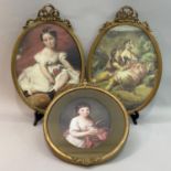 A pair of gilt oval picture frames with ribband creating, overall 45cm x 31.5cm, the glass 36.5cm
