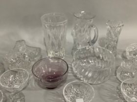 A Caithness amethyst glass bowl on foot,cut glass vases, trifle bowls, and other glassware