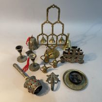 A Chinese bronze Guanshiyin bell, brass meditation bell tree, a Tibetan prayer wheel with