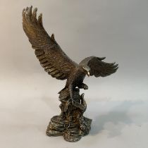 A filled white metal (tests as silver) model of an Eagle by Country Artists, modelled landing on a