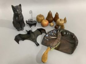 A garden cat ornament, tin bat coat hook, flying pig, an art nouveau copper crumb scoop and brush