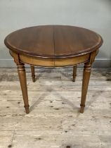 A good modern cherry wood dining table of oval outline on turned legs, with extra leaf, 160cm with