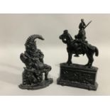 Two cast iron doorstops in the form of Punch and the other in the form of a cavalry officer on a