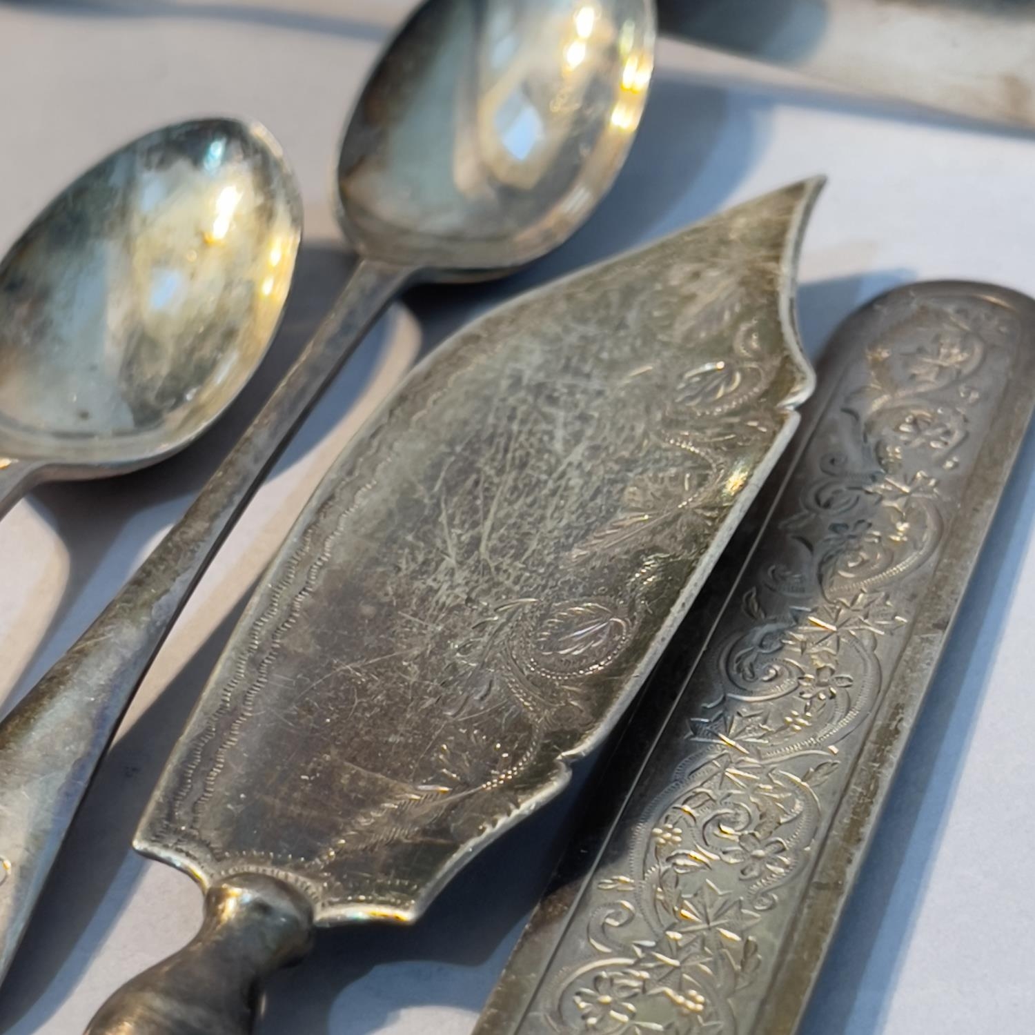 A collection of 19th and early 20th century silver spoons, pickle fork, sugar tongs etc - Image 2 of 2