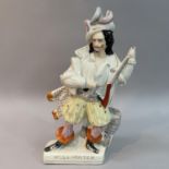 A mid 19th century Staffordshire figure of Will Watch standing with gun and powder horn beside